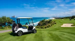 Electric golf cart parked under direct sunlight on a coastal resort path with accessible battery compartment